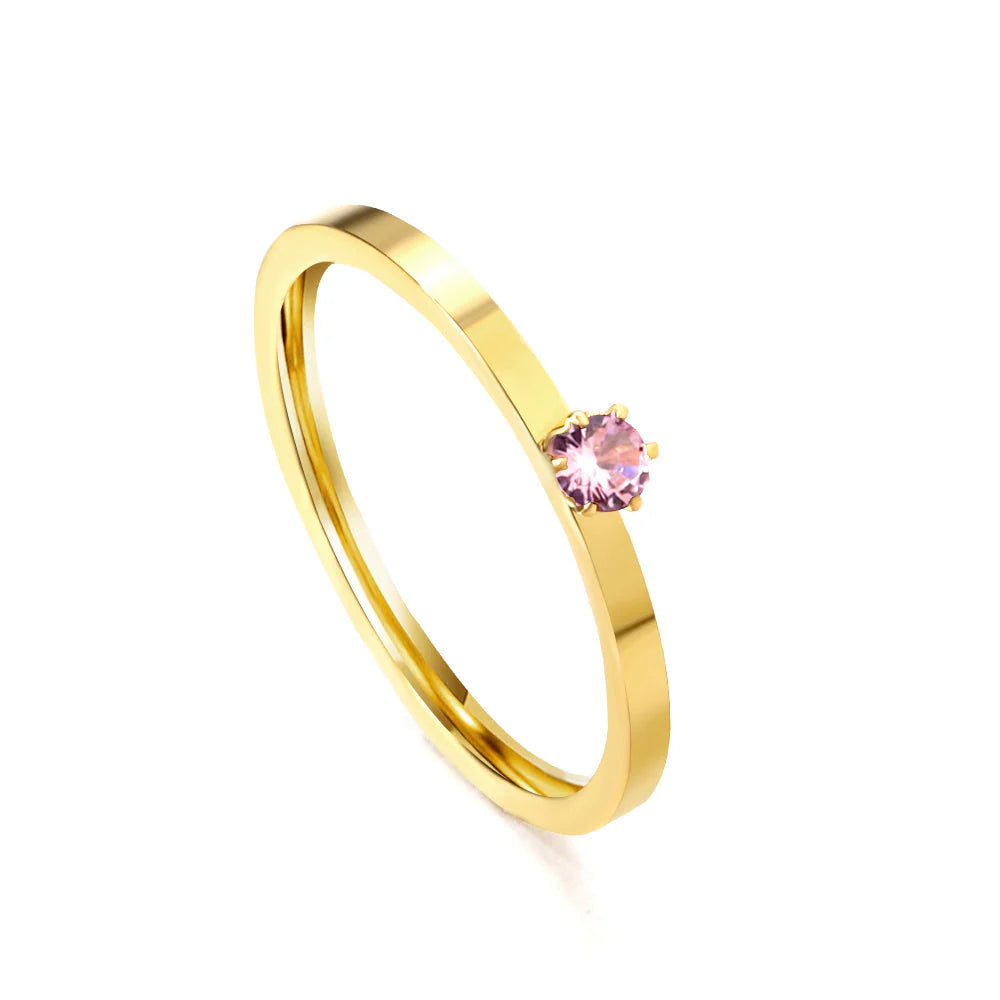 Anello semplice e lineare in oro con zirconi multicolore.